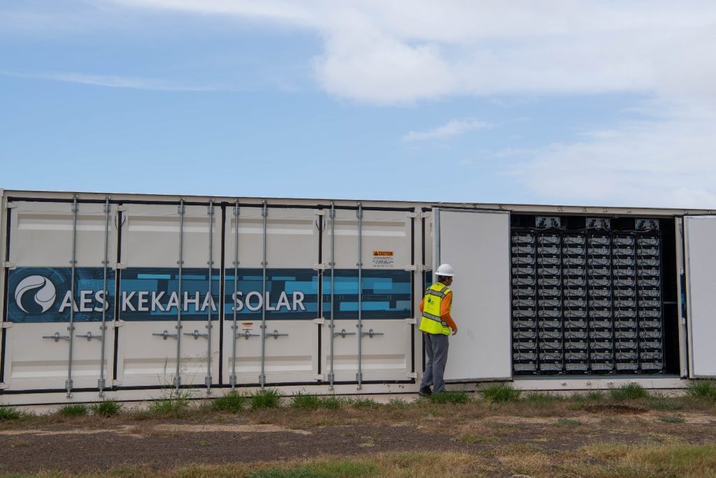 A worker looks at a solar energy facility.